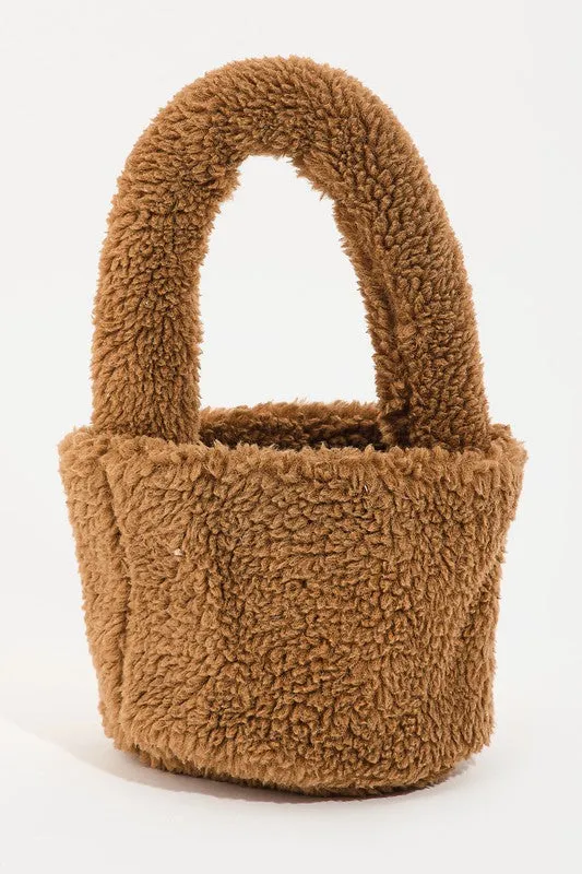 The ‘Shearling Top Handle Bag’